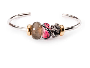 silver Trollbeads bangle with gold spacers and faceted labradorite bead, pink butterfly glass bead and a silver spacer with many small butterflies